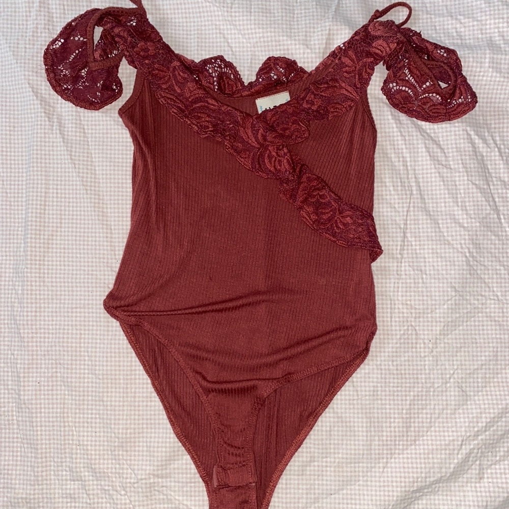 Maroon bodysuit with lace accents on top!